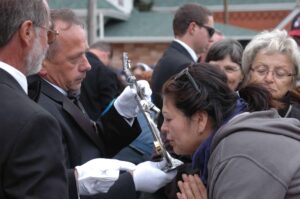 Parishioners of St. Joseph Polish Parish and Our Lady of Guadalupe Parish venerate a relic of St. John Paul II.