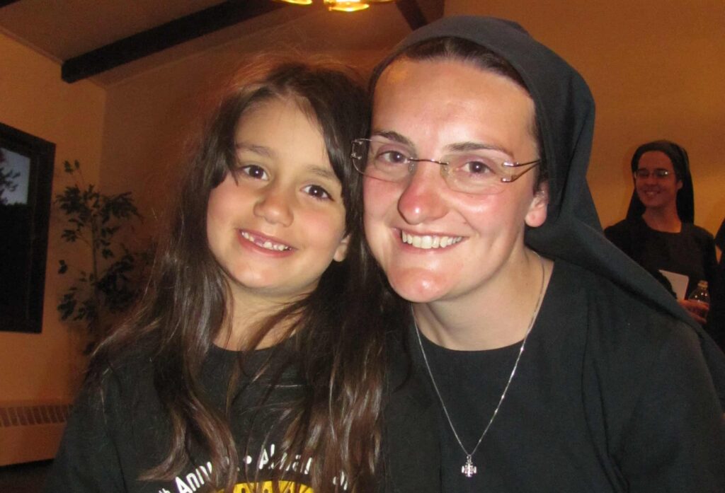 Sister Sara of the Missionaries of St. Charles Borromeo spends time with youth during a visit to Denver. Two sisters will arrive in Broomfield this summer.