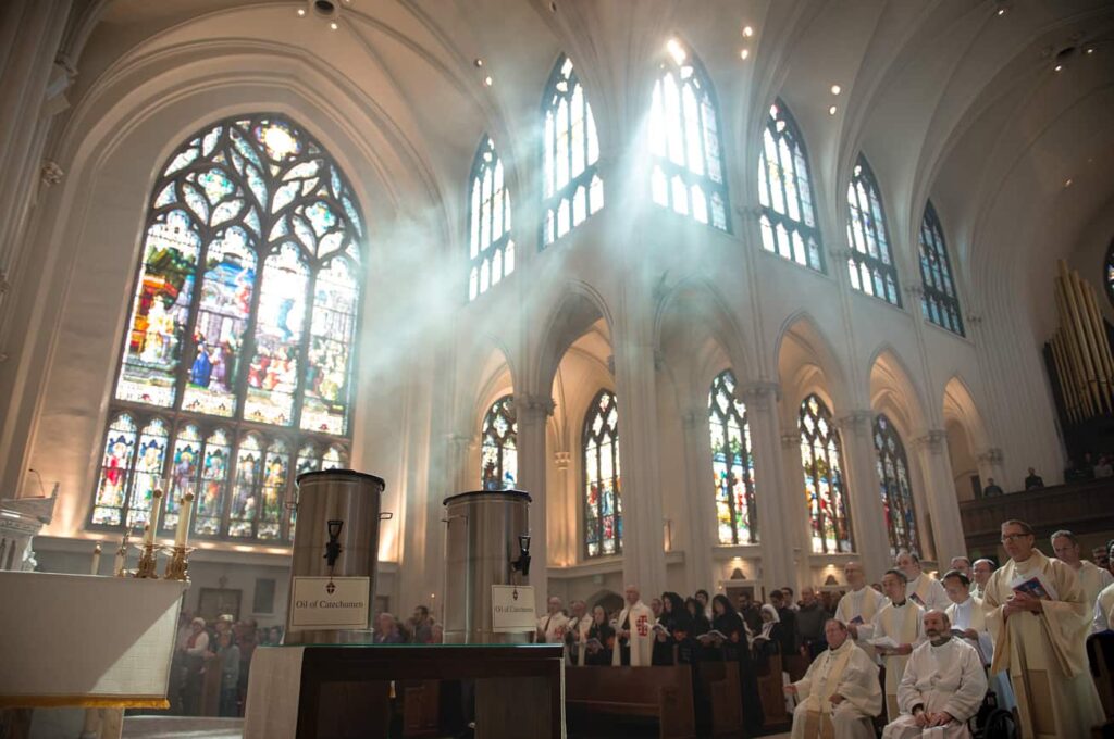 DENVER, CO, March 23, 2016 - Three different holy oils are blessed during the Chrism Mass: the oil of catechumens, the oil of the infirm and chrism oil. (Photo by Dan Petty/A&D Photography)