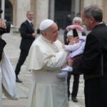 Vatican City – May 21, 2014: Pope Francis greets pilgrims in St. Peter’s Square during the Wednesday general audience, May 21, 2014.