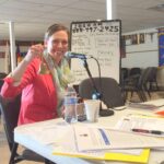 Pledge Drive Karna Ringing the Bell