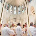 DENVER, CO – FEBRUARY 6: From left, John Mrozek , Peter Wojda, Daniel Ciucci and Shaun Galvin get hugs of congratulations from other deacons during their transitional diaconate ordination at the Cathedral Basilica of the Immaculate Conception on February 6, 2016, in Denver, Colorado. (Photo by Daniel Petty/Denver Catholic)